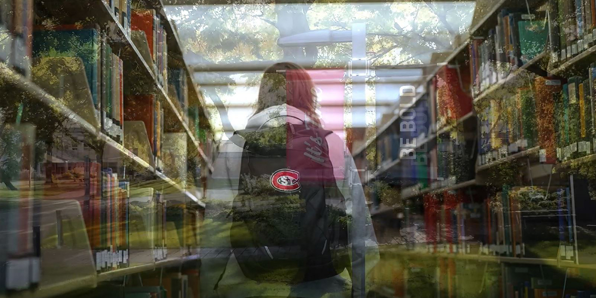 Student walking through library