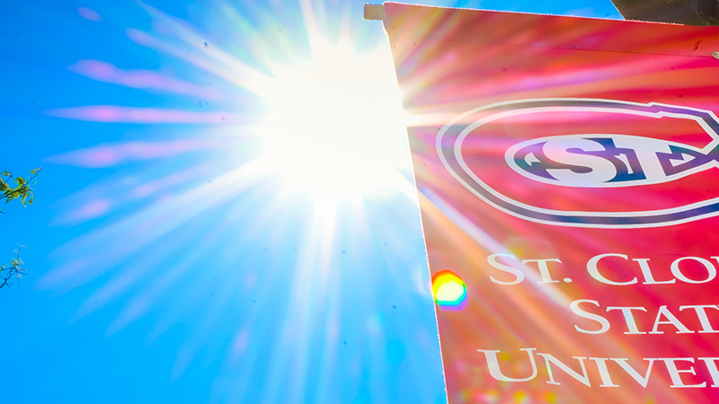 Bright sunshine behind red SCSU banner