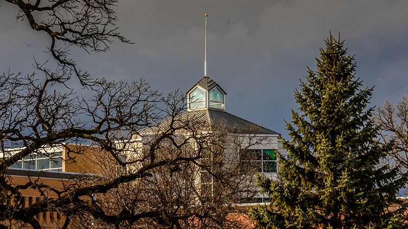 Dark clouds behind Miller Center building