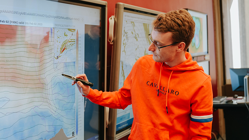 Student using a stylus pen on interactive screen