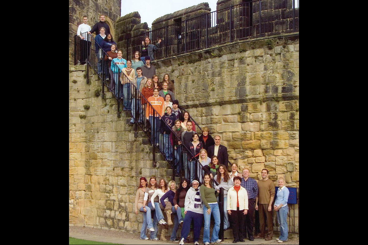 Class photo in front of castle