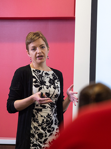 Female professor speaking to class