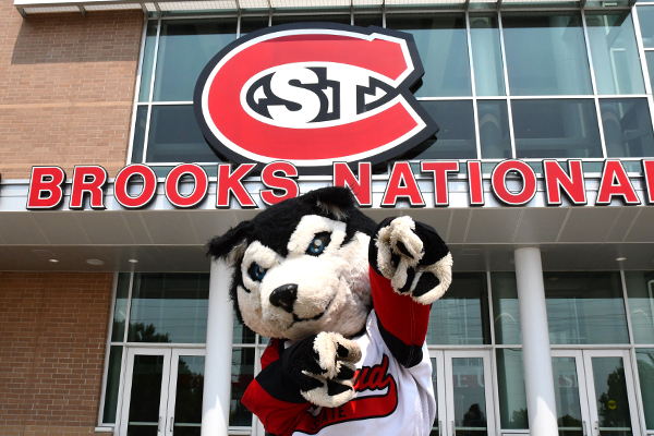 Blizzard mascot outside Herb Brooks Arena with St. C sign behind