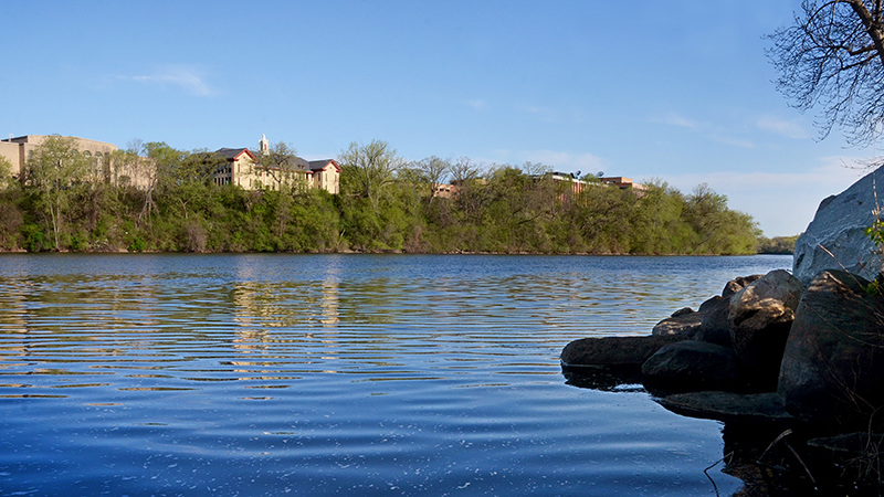 Riverbank with campus in background