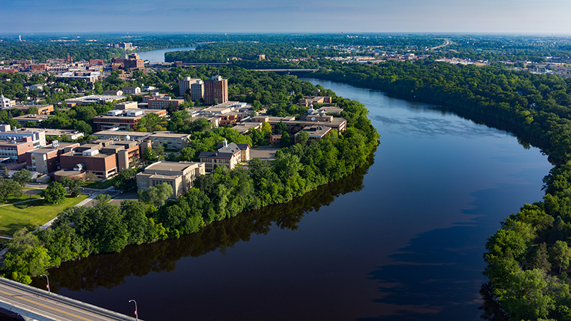 Aerial view of river and campus