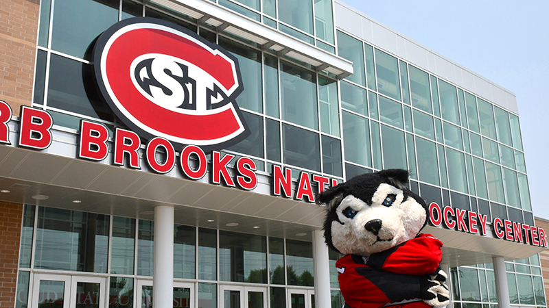 Blizzard mascot standing outside Herb Brooks Hockey Center entrance