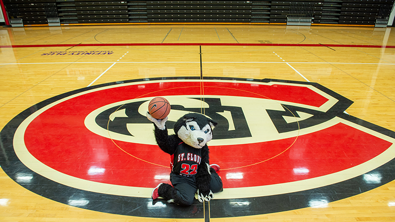 Blizard mascot at center court of Halenbeck Hall Gym