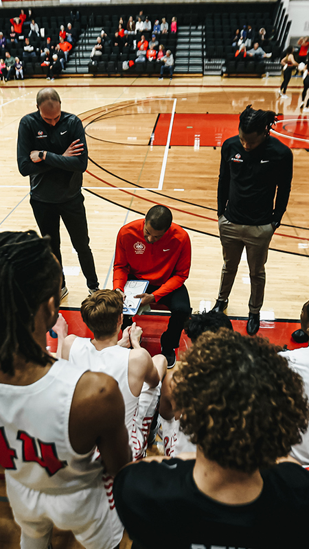 Coaches huddle at SCSU basketball game