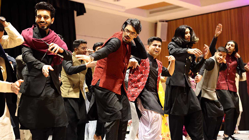 Pakistani students dancing on stage