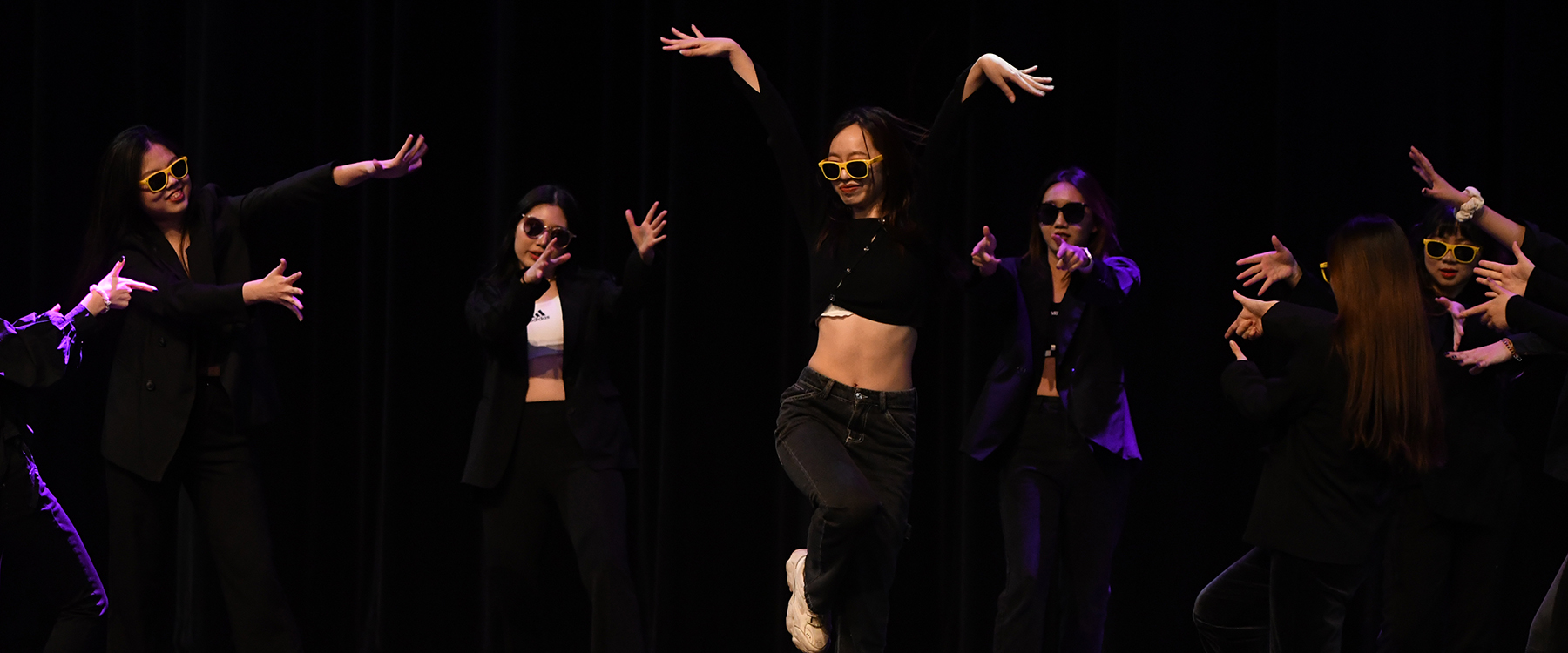 Female dancers dressed all in black