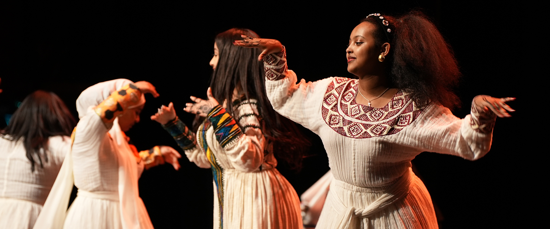 Female dancers in white dresses