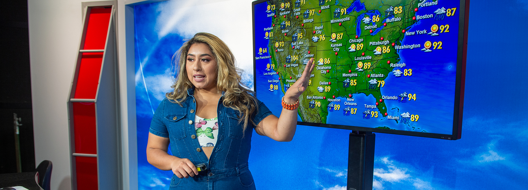 Student practicing with weather map on screen