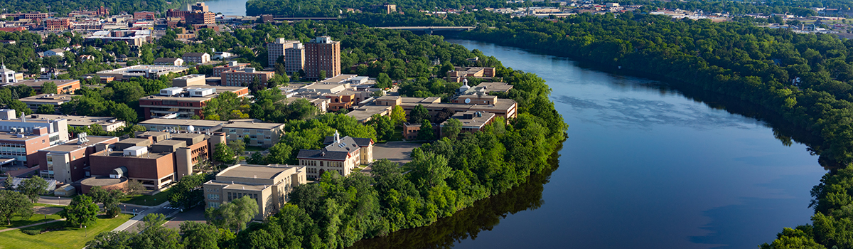 Aerial view of campus on river