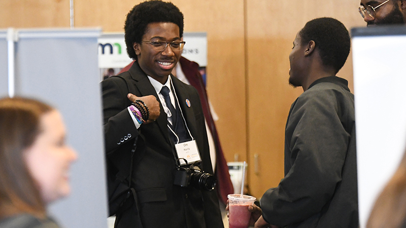 Young man attending Power in Diversity Conference job fair