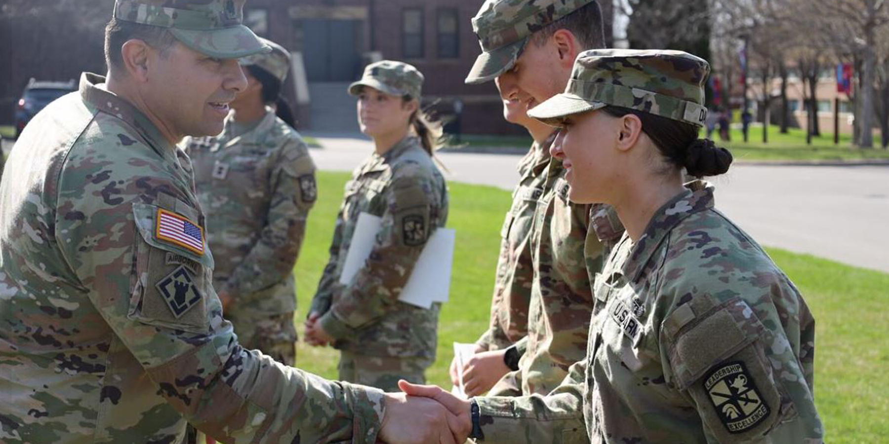 Cadet shaking the hand of officer