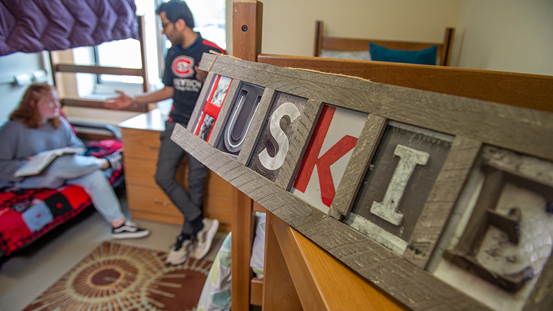 "Huskies" sign in dorm room