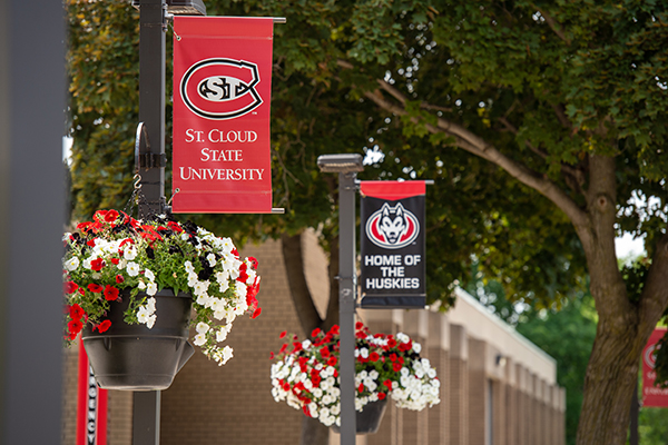 SCSU banners and flowers on campus poles